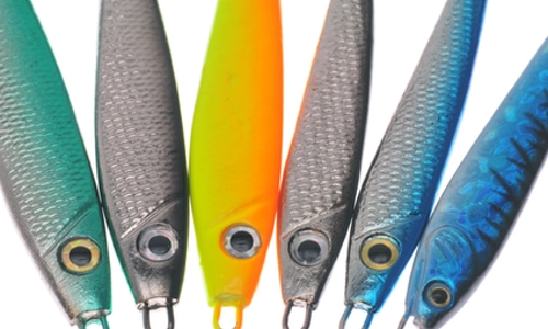 Assorted striper fishing jigging spoons and hard baits used for Lake Texoma striped bass fishing.