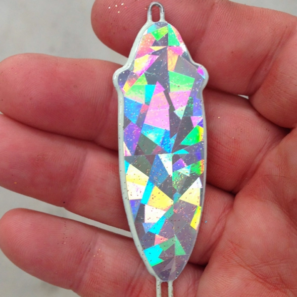 chartreuse and holographic slab spoons for striped bass fishing on Lake Texoma showing different shapes and finishes